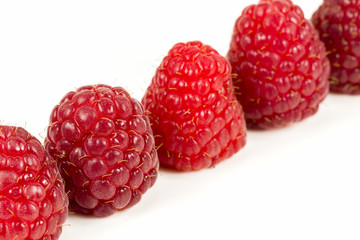 fresh red raspberries isolated on white background