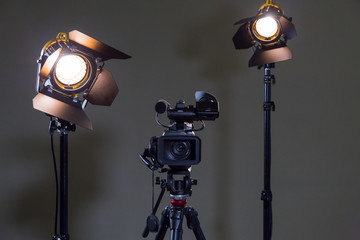 Camcorder and 2 spotlights with Fresnel lenses in the interior. Shooting an interview.