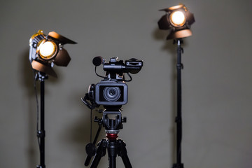Camcorder and 2 spotlights with Fresnel lenses in the interior. Shooting an interview.
