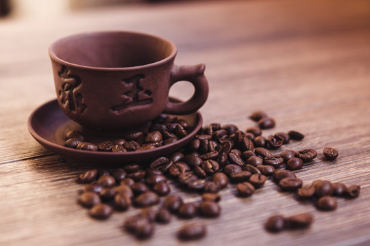 cup of coffee with roasted coffee beans, can be used as a background.