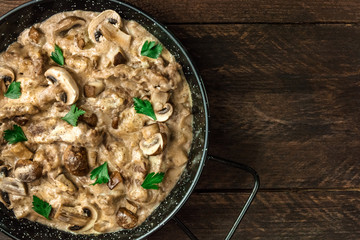 Mushroom beef stroganoff in pan with copy space