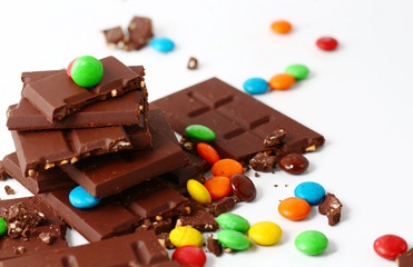 sweet chocolate bar and color candy in white background