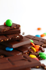 sweet chocolate bar and color candy in white background