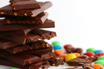 sweet chocolate bar and color candy in white background