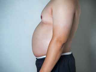 Body part of asian fat man with a big belly
