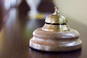 Service bell in a hotel reception for concierge alarm on desk.