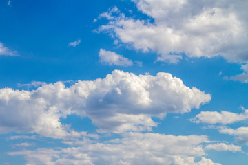 Naklejka na ściany i meble beautiful white clouds background in a blue sky
