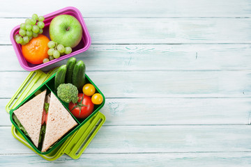 Lunch box with vegetables and sandwich