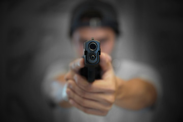 hand pointing a gun forward