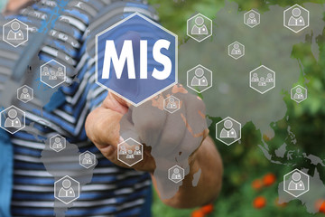 Farmer businessman pushes a button MIS, Management Information System on the touch screen