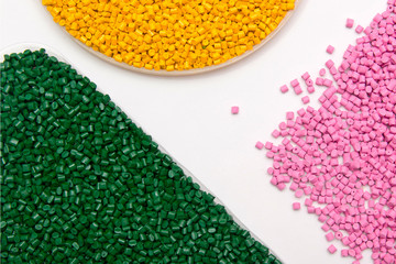 The plastic granules. Dye for polypropylene, polystyrene granules into a measuring container