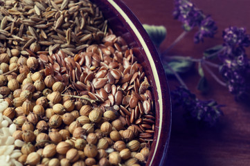 Spices and herbs in ceramic bowl. seasoning. Colorful natural additives.