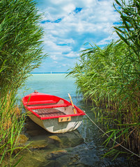 Red boat on lake Balaton in summer