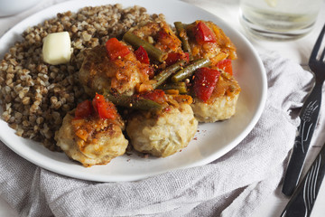 Meatballs with vegetable sauce and buckwheat