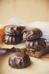 small chocolate-covered cream cake
