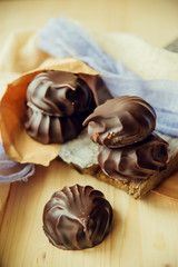 small chocolate-covered cream cake