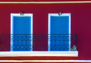 Two doors on red facade