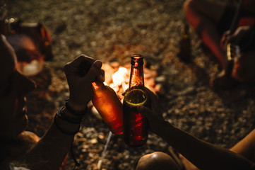  Friends Gathered Around a Campfire © karrastock