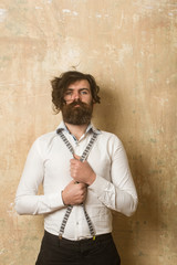 Man with long beard and mustache on face.
