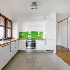 White, open kitchen with window