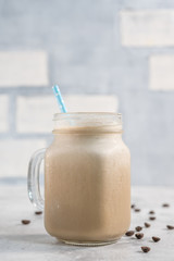 Coffee vanilla protein shake smoothie in mason jar