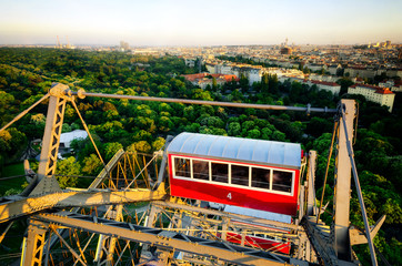 Fototapeta premium Sunset panorama of Vienna from the famous Prater Riesenrad, old giant ferris wheel and famous landmark of the city