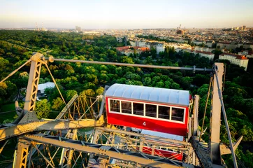 Fotobehang Sunset panorama of Vienna from the famous Prater Riesenrad, old giant ferris wheel and famous landmark of the city © Alessandro Cristiano