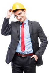 Businesswoman in yellow construction helmet posing on white background