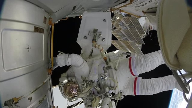 POV, Astronaut Holds Onto Space Station Over Earth
