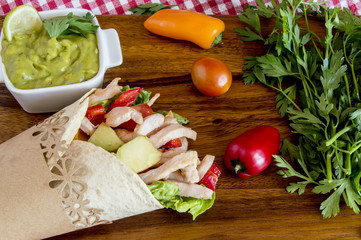 Tortillas with vegetables and chicken meat.