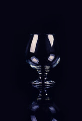 glass for cognac on black background