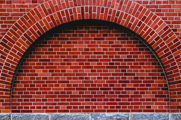 Arch od red brick wall artistic background, regular texture