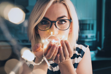 Portrait of woman in glasses with led fibre