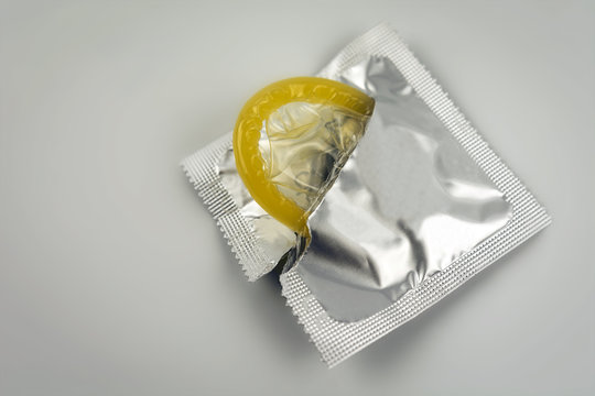 Condom close-up isolated. Contraceptive protection from  AIDS.