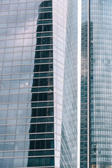 Low angle view of  skyscrapers in business district against sky