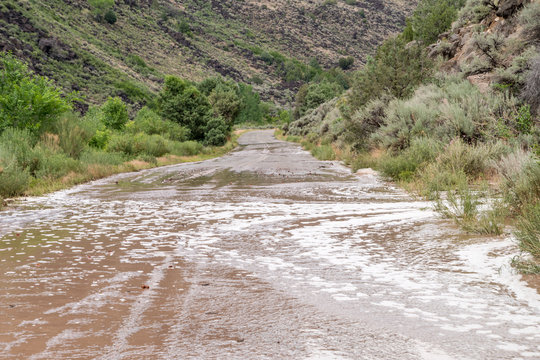 Flooded road into the Rio Grande gorge.