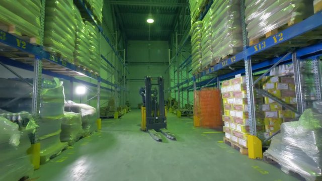 A speedy turn of a warehouse stacker during work.    
