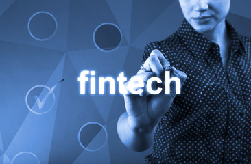 Fintech Concept with businesswoman touching the screen