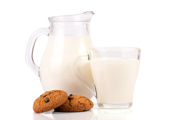 jug of milk with oatmeal cookies isolated on white background