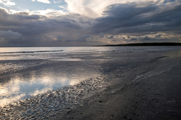 Beach scene with moody sky