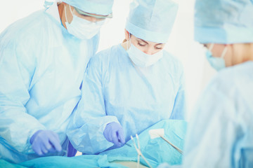 Young surgery team in the operating room . Operating room