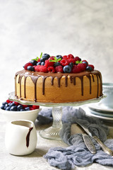 Homemade summer sponge cake with cream and fresh berries.