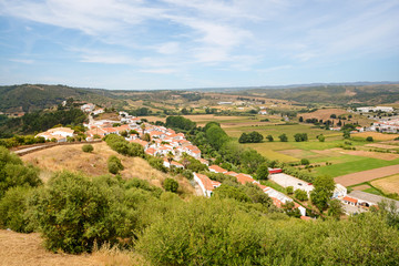 Fototapeta na wymiar View to the small town of Aljezur with traditional portuguese houses and rural landscape, Algarve Portugal