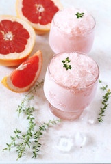 Grapefruit granita, frozen summer dessert in two glasses