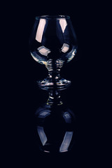 glass for cognac on black background