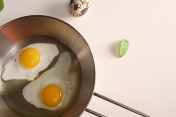 Fried eggs quail egg on a white background