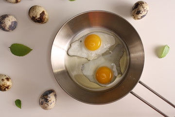 Fried eggs quail egg on a white background
