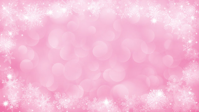 Christmas background with frame of snowflakes and bokeh effect in pink