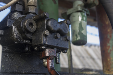 Old dirty aggregate covered with fuel oil