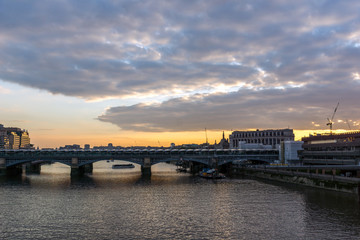 Amazing sunset Cityscape from Millennium Bridge and Thames River, London, Great Britain